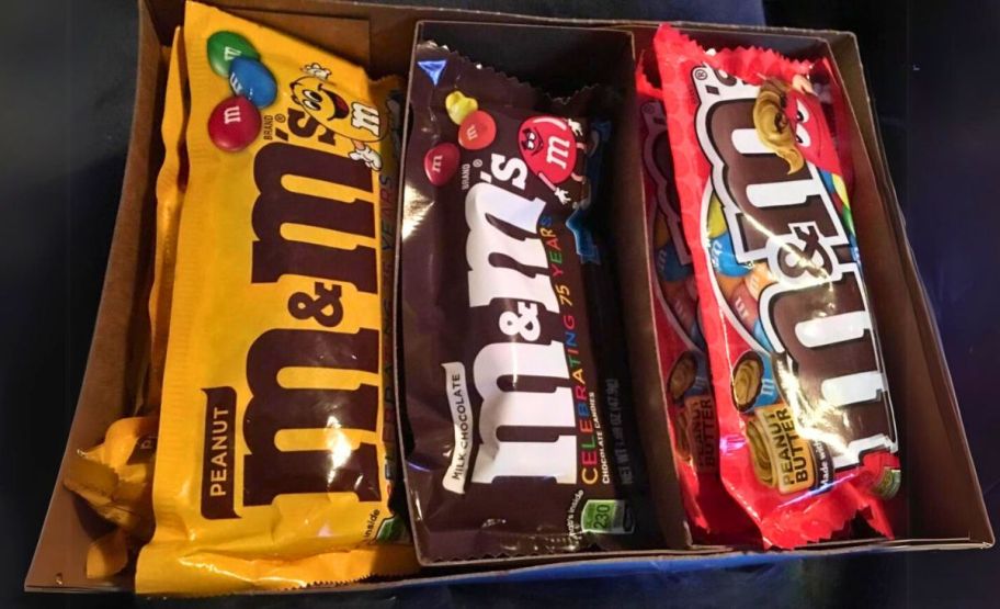 a box with 3 varieties of full-size packs of m&ms on a counter top