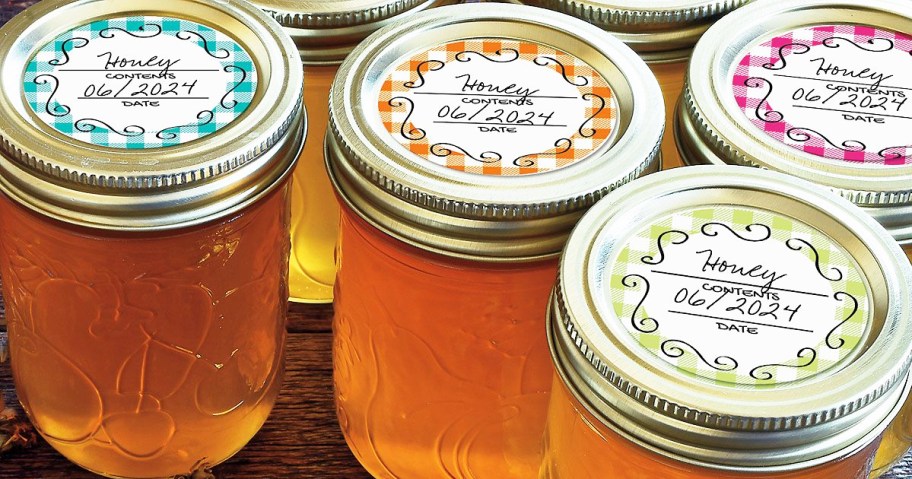 mason jars filled with honey with labeled lids