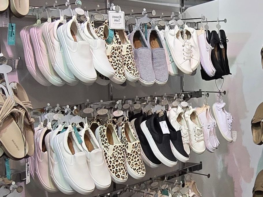 A rack of slip on sneakers at maurices