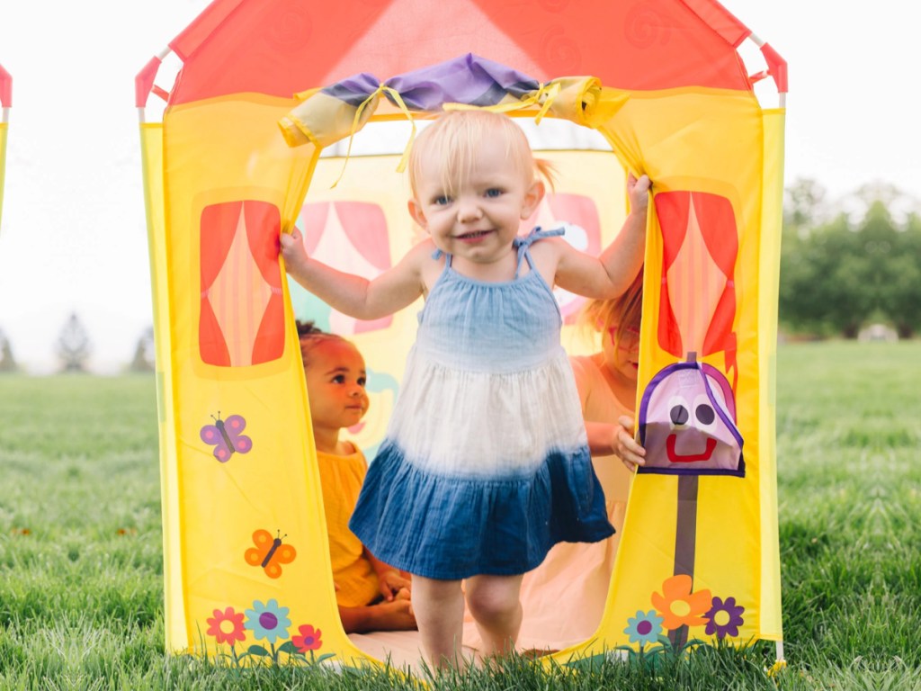 little girl coming out door of blues clues play tent
