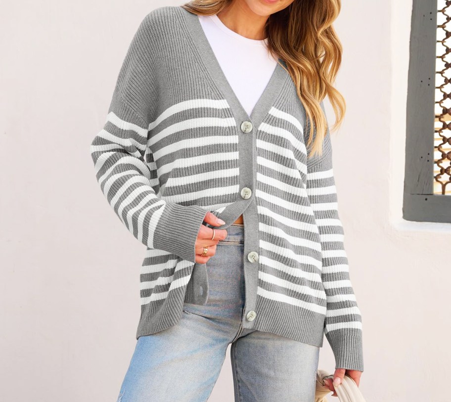 woman in a grey and white striped cardigan