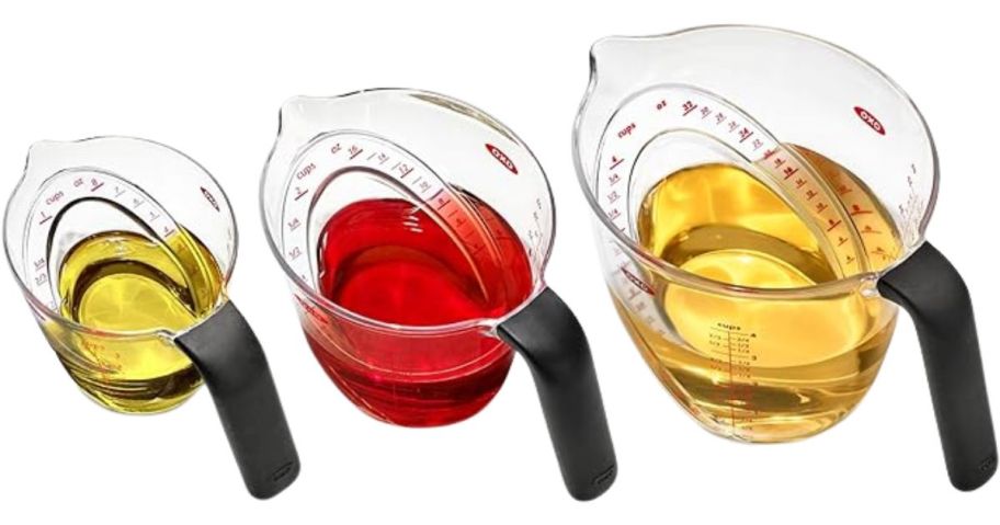 OXO Good Grips 3-Piece Angled Measuring Cup Set with liquid in them