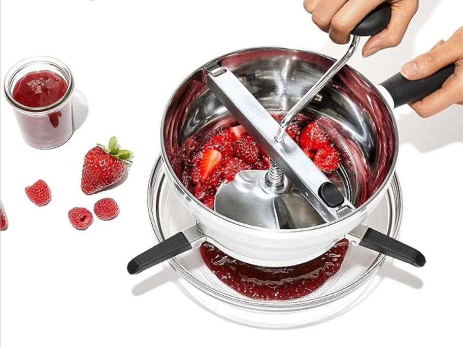 OXO Good Grips Stainless Steel Food Mill for Purees with strawberries in it