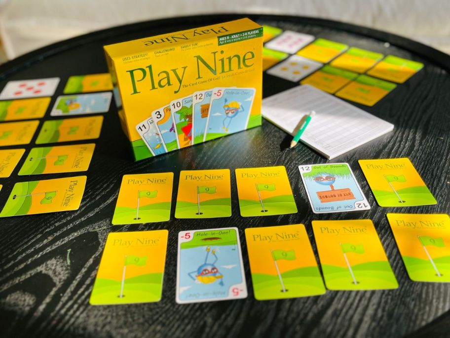 Play nine gold card game displayed on a table