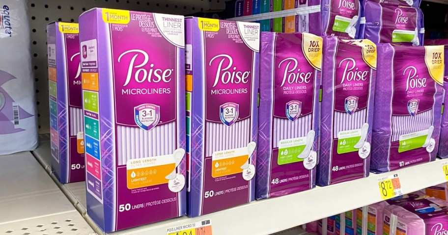 pink and purple boxes of Poise liners on store shelf