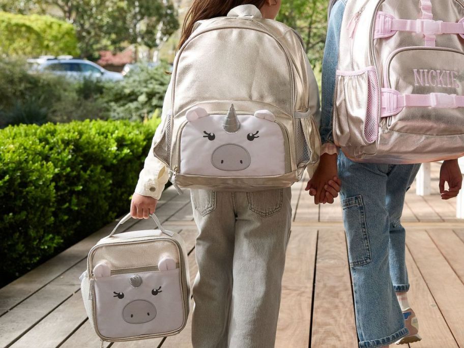 two girls walking wearing Pottery Barn backpacks and carrying a matching lunch bag