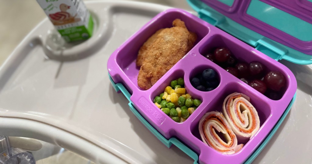 kids bentgo box filled with lunch items on highchair tray