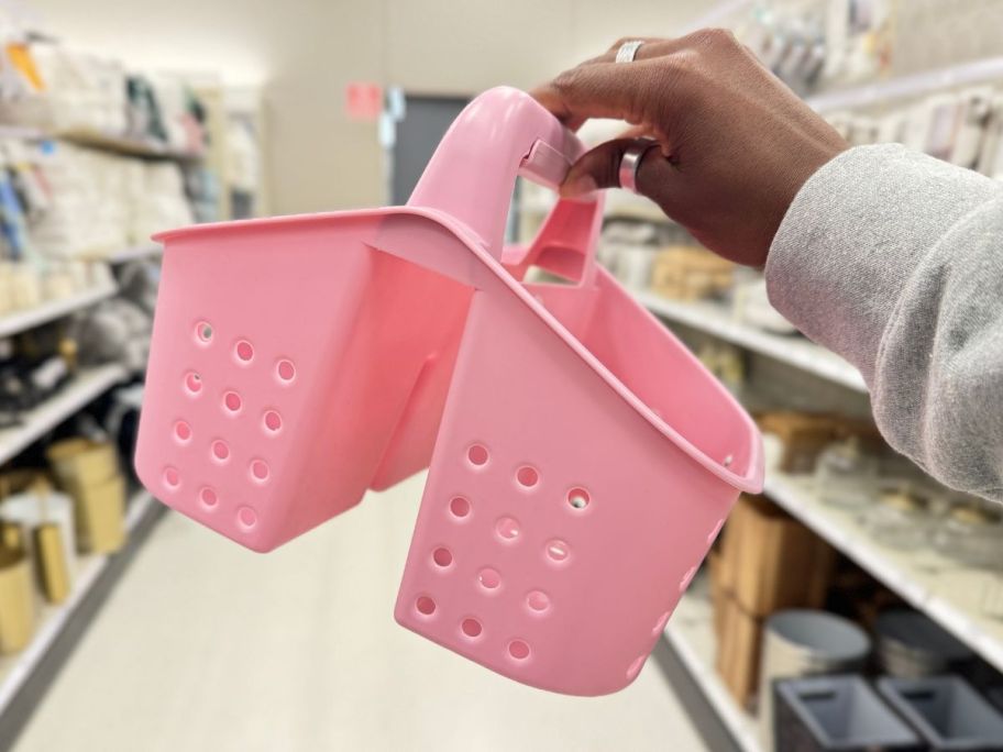 Room Essentials Shower Caddy being held by hand in store