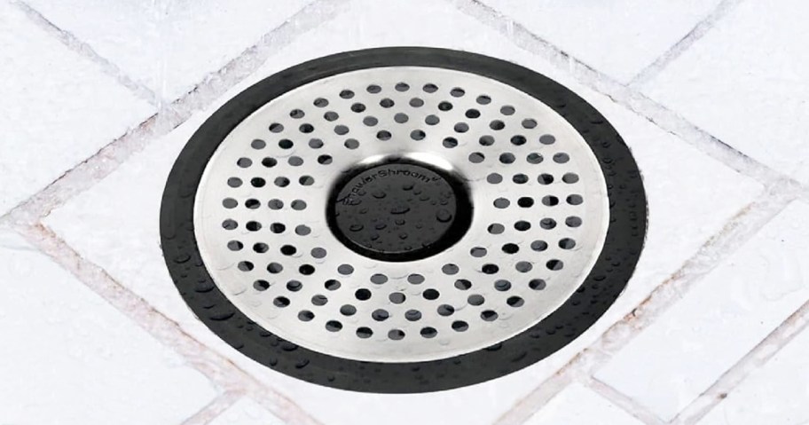 stainless steel ShowerShroom over a shower drain