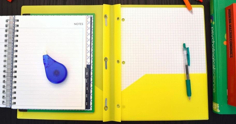 Smead pocket Folders with pens, paper and other school supplies