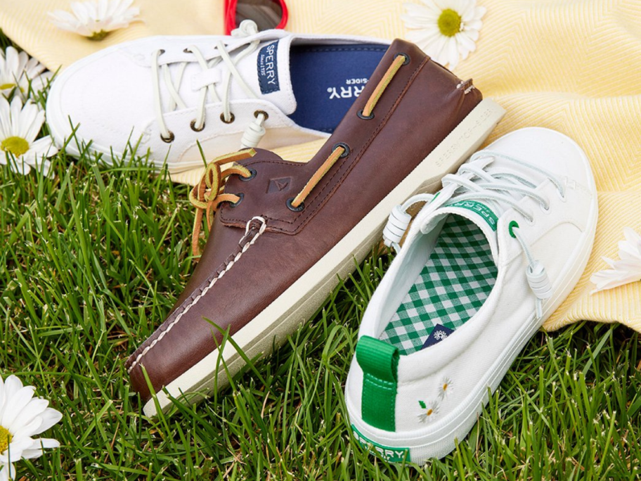 3 pairs of Sperry Shoes on a blanket on grass