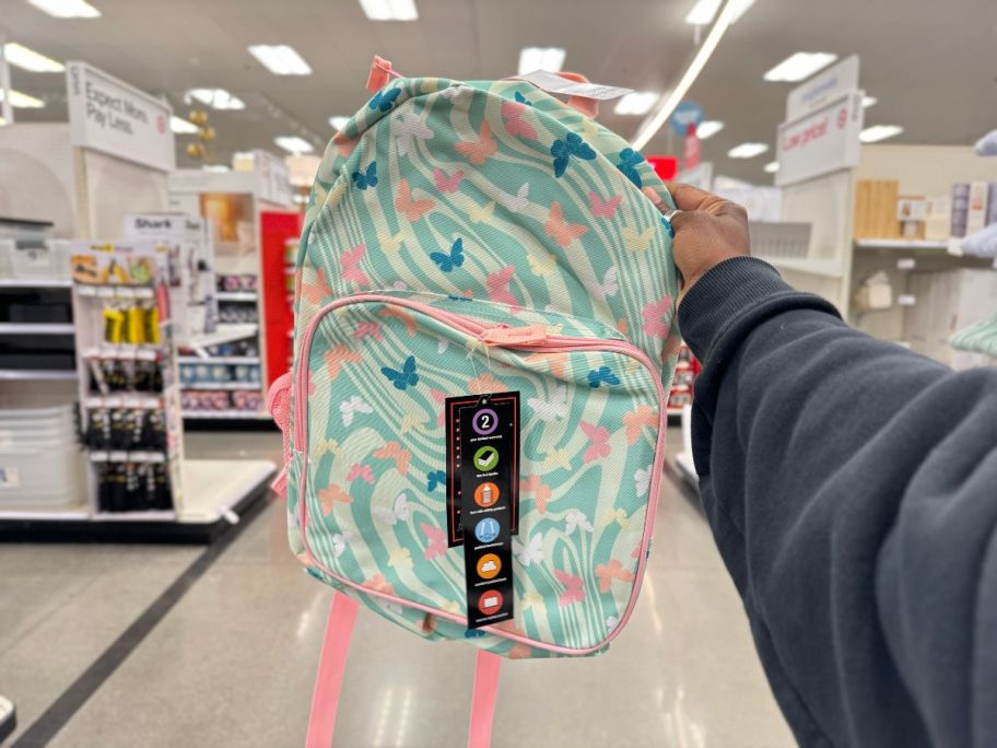 A backpack with a butterfly swirl print 