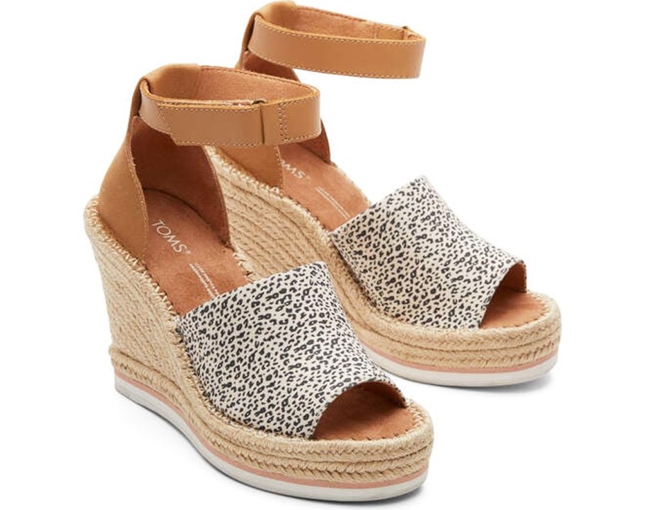 pair of wedges with brown straps and leopard print