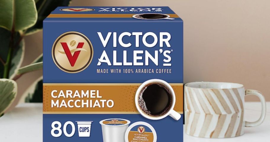 Victor Allen's Coffee Caramel Macchiato Flavored, 80 Count box on table next to coffee cup