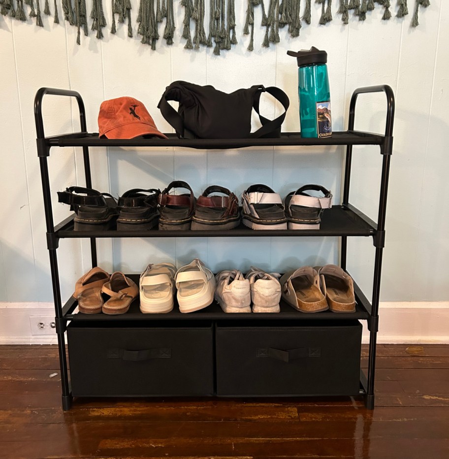 A closet organizer with shoes and other college items