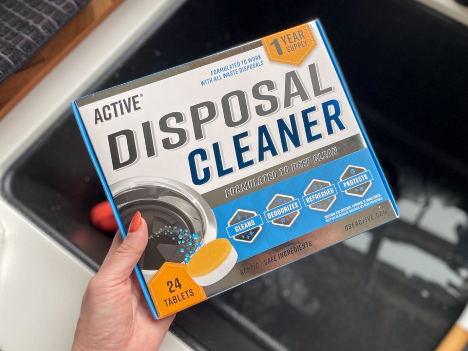 hand holding disposal cleaner box