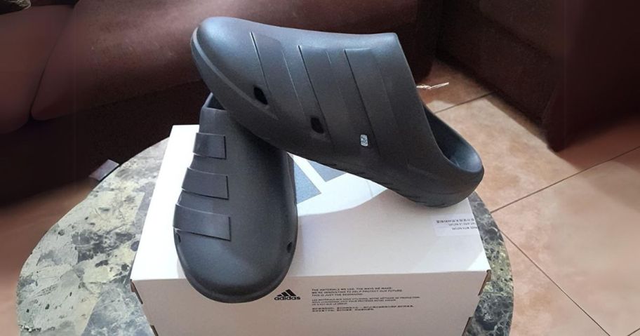 adidas Unisex-Adult Adicane Clogs in Black on shoe box