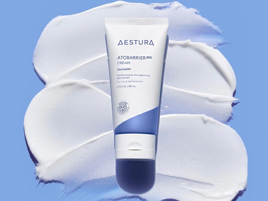 aestura cream laying on table with cream laying under it 