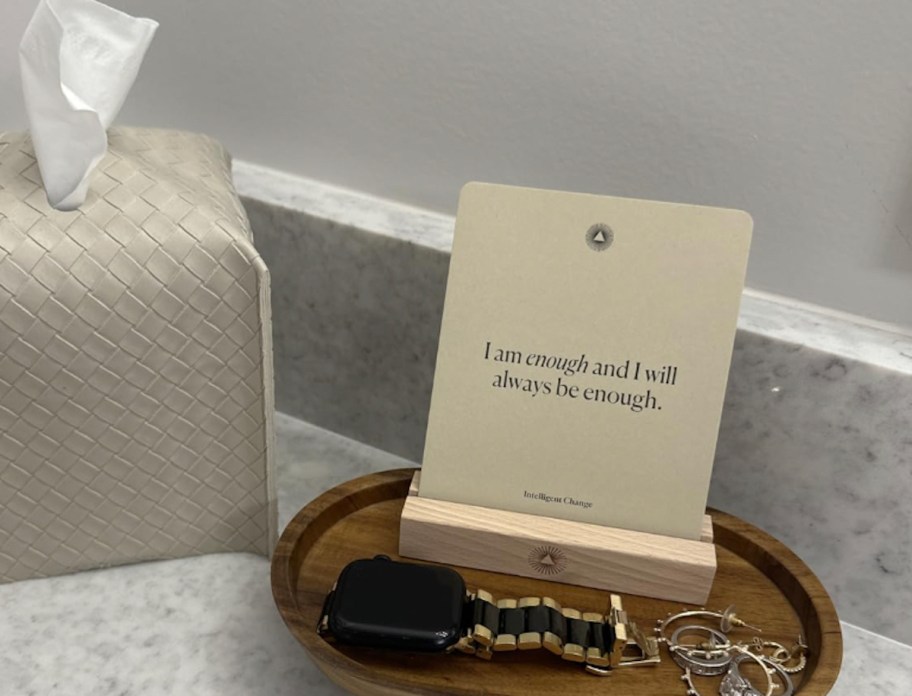 affirmation card on wood stand on counter