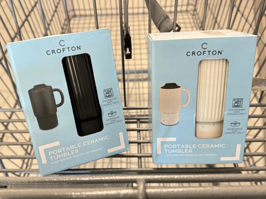 shopping cart with a black and white Portable Ceramic mug in the packaging they come in
