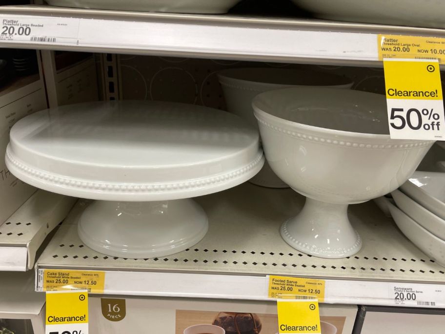 cake stand and bowl on shelf in store