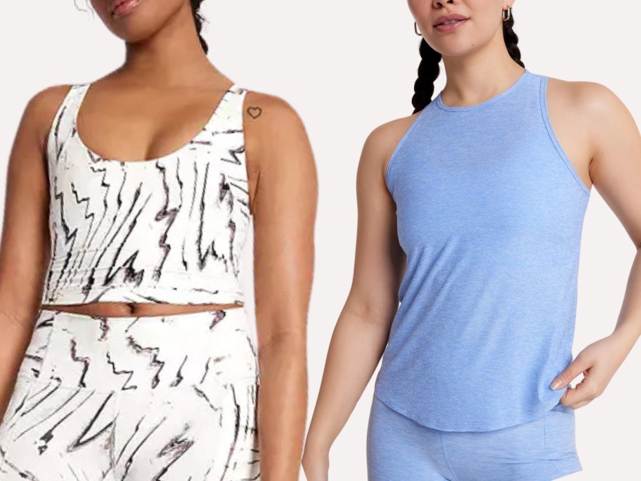 women wearing athletic tops, 1 cropped white and black, 1 sleeveless light blue