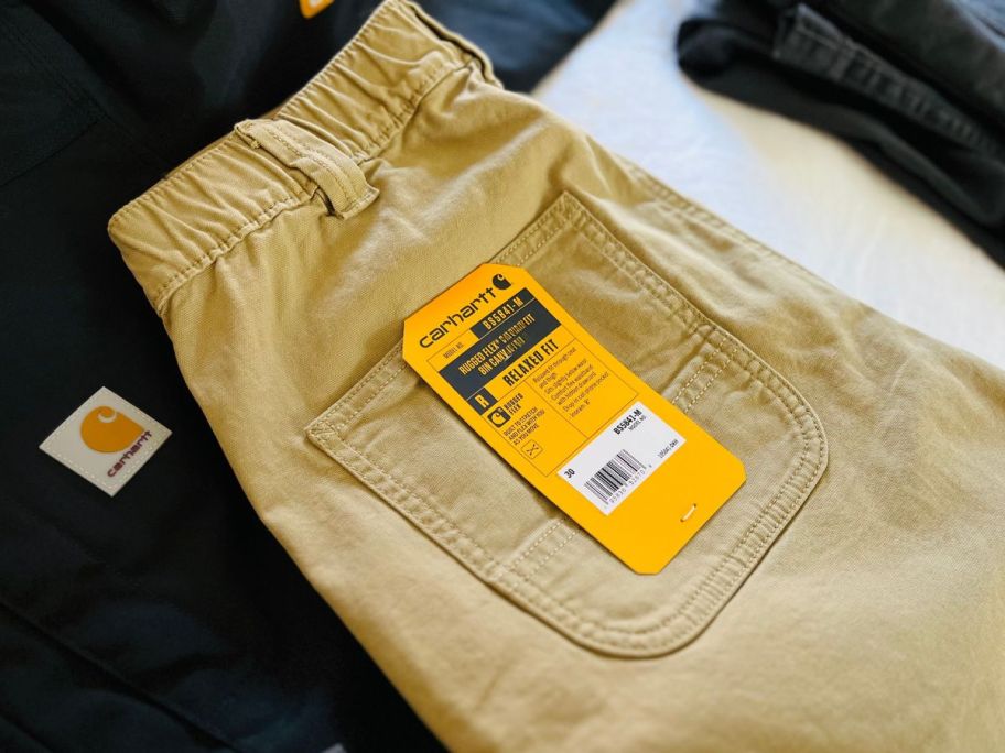 carhartt pants on bed