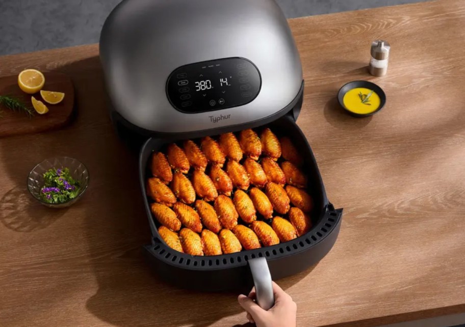 dome air fryer with wings inside of it