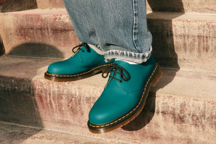 teal oxford shoes on steps