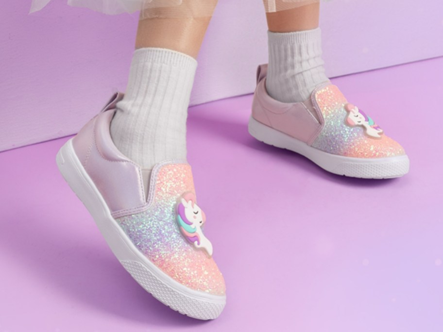 little girls feel wearing sparkly Unicorn slip on sneakers