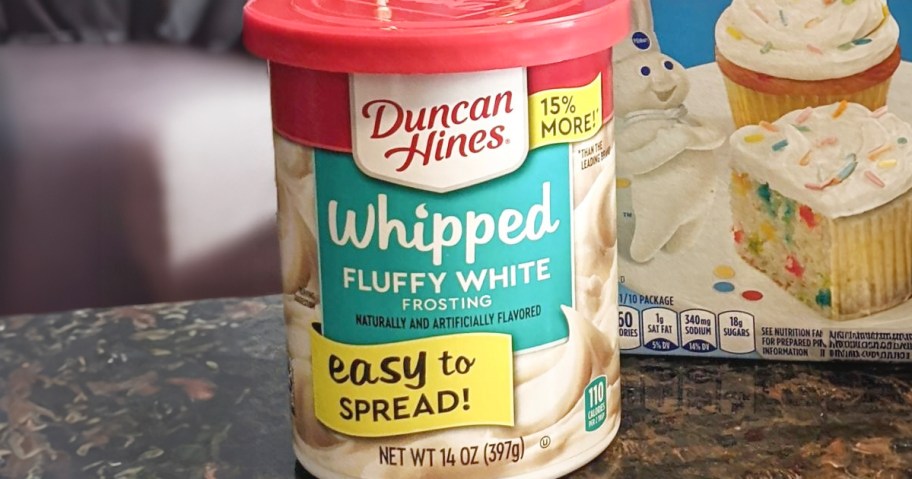 duncan hines whipped white frosting jar on table