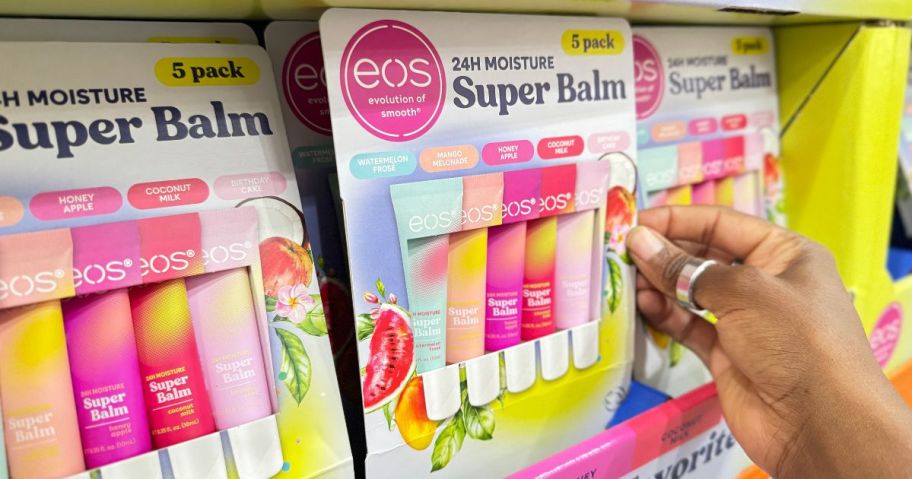 eos Super Balm 5-Tube Packs on display in store with a hand grabbing one