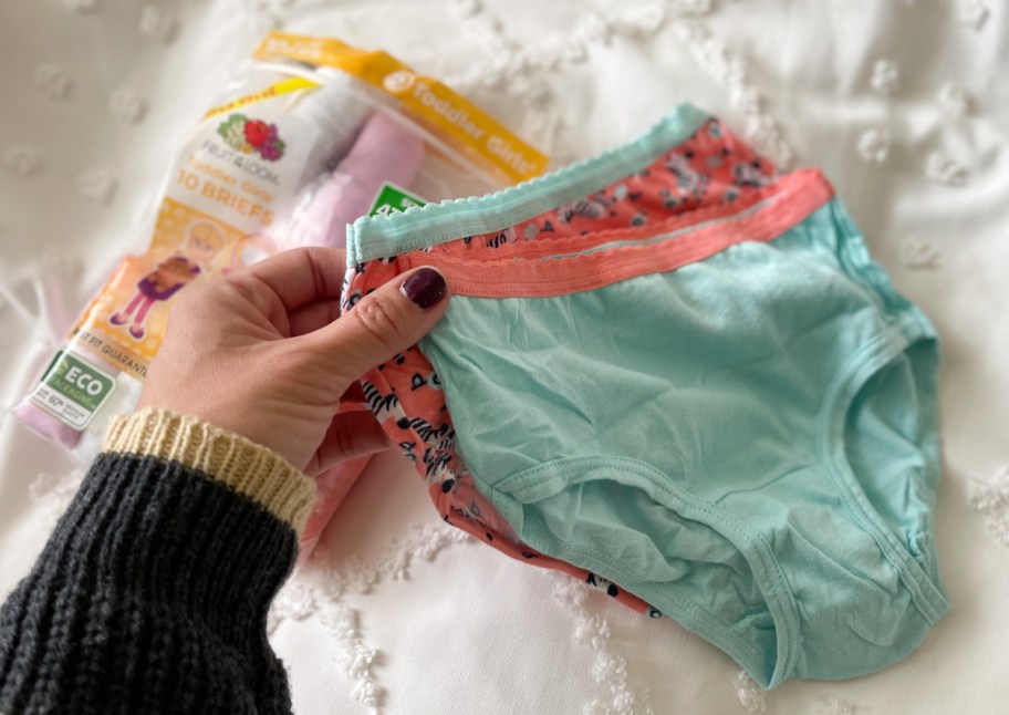 Hand holding woman's underwear