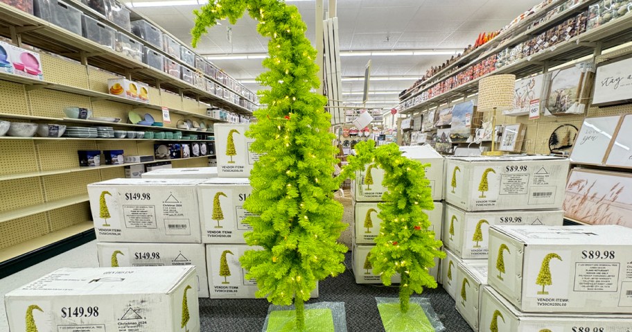tall and short green grinch christmas trees 