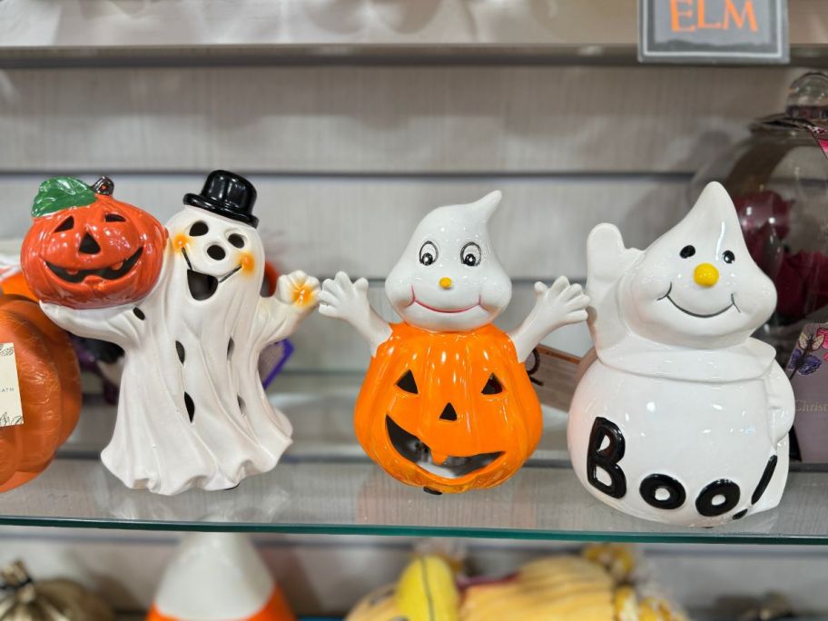 3 decorative ceramic halloween figurines on store shelf
