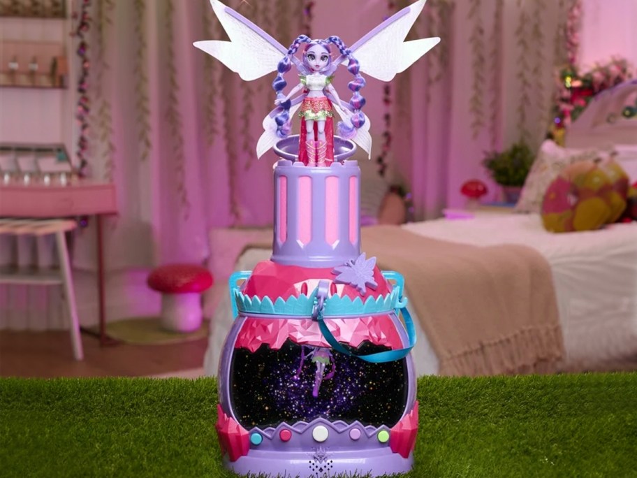 pink holobrite pixie toy with girls room in background 