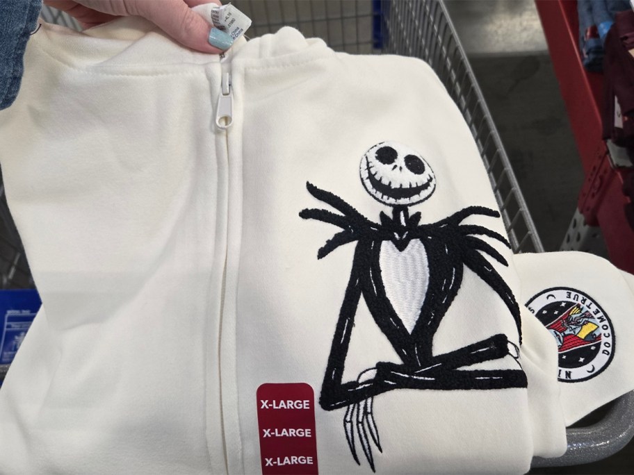 hand holding white jack skellington hoodie