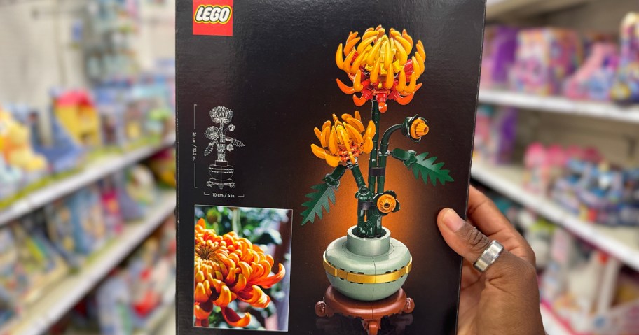 hand holding lego chrysanthemum set 