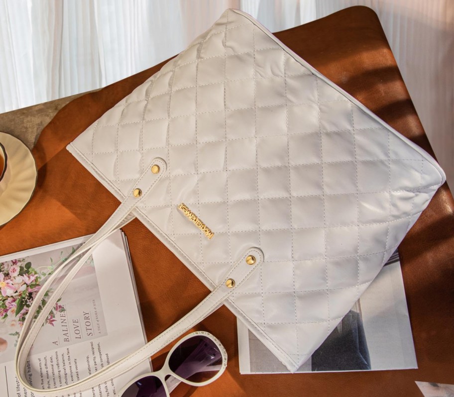 white quilted tote bag laying flat