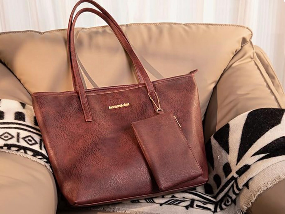 Burgundy montana west tote with pouch on chair 