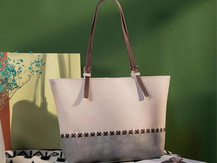 white and gray tote on table