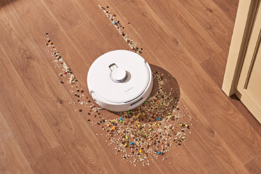 white robot vac cleaning sprinkles