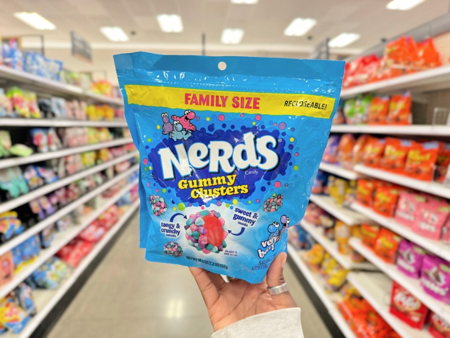 person holding up a bag of nerds gummies