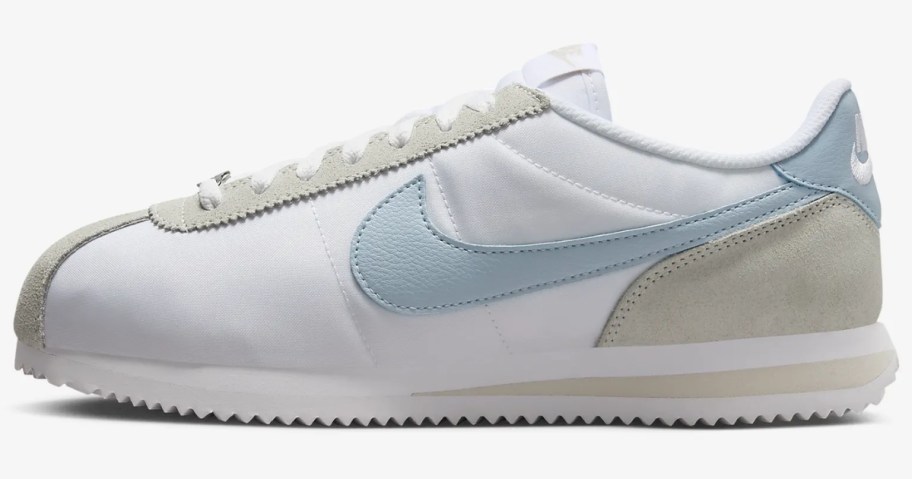 adult's Nike Cortez shoe in white with light tan and light blue accents