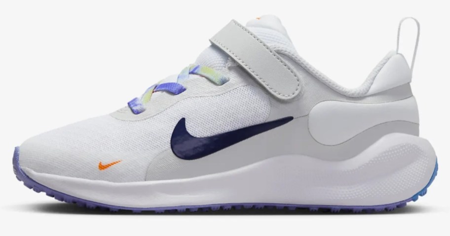 little kid's Nike shoe in white with blue and multicolor accents