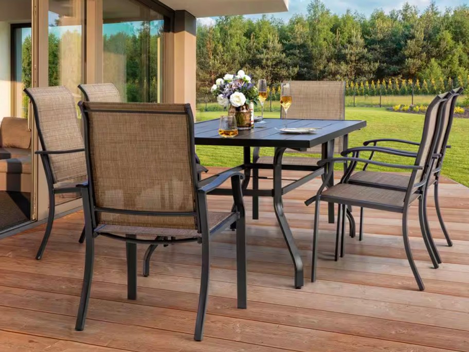 tan dining set on patio 