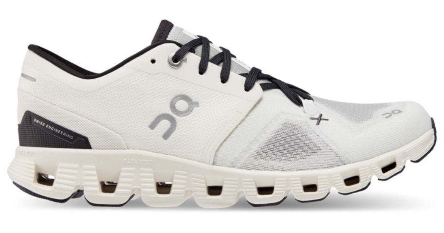 a white with black accents On running shoe