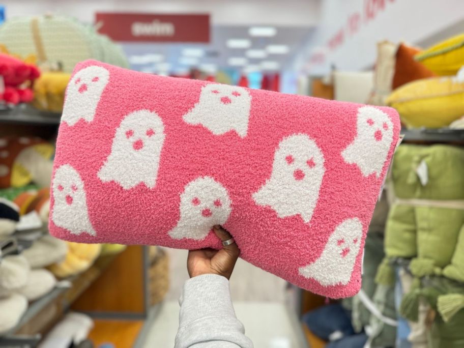 pink halloween pillow with white ghosts