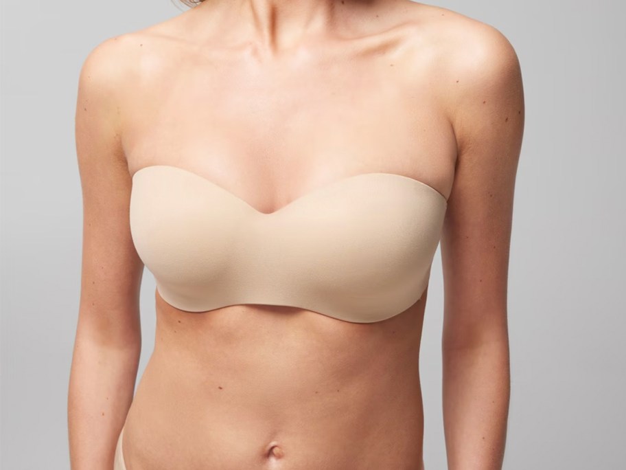 woman wearing beige wireless strapless bra