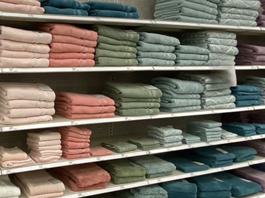 bath towels on shelves in store